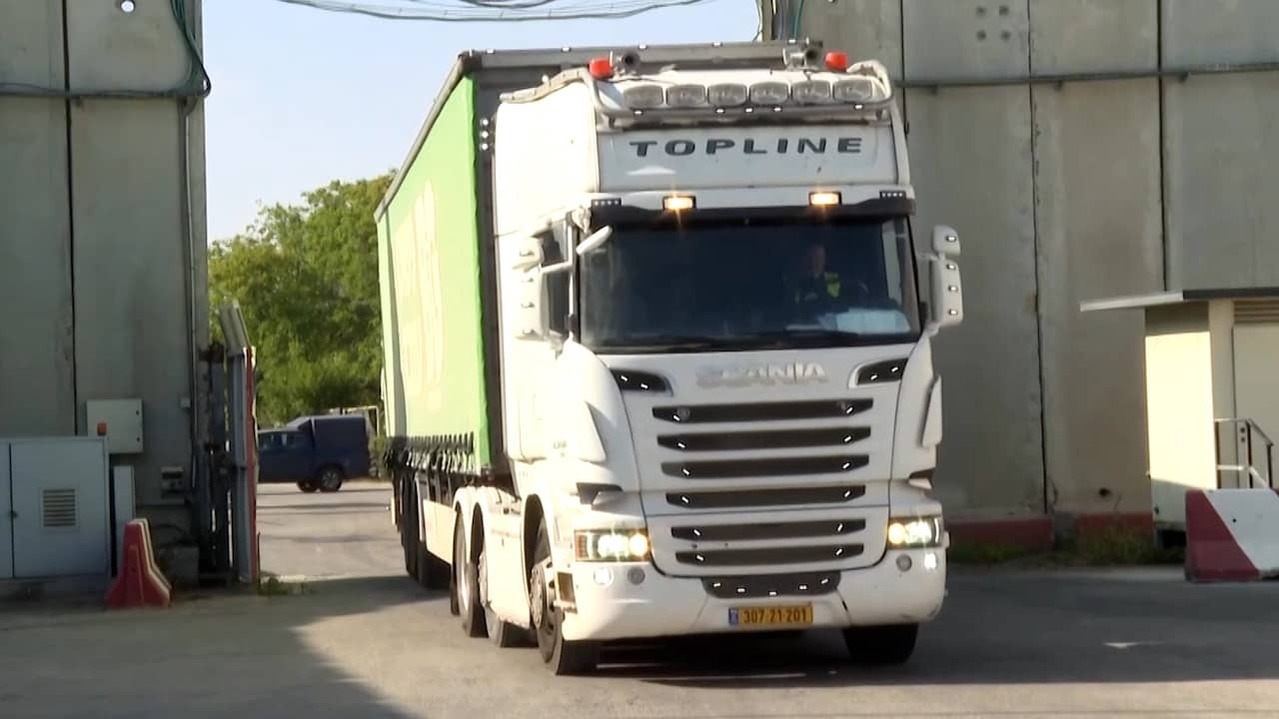 Image from Video: Trucks with Aid Drive Into Gaza While Attacks Continue