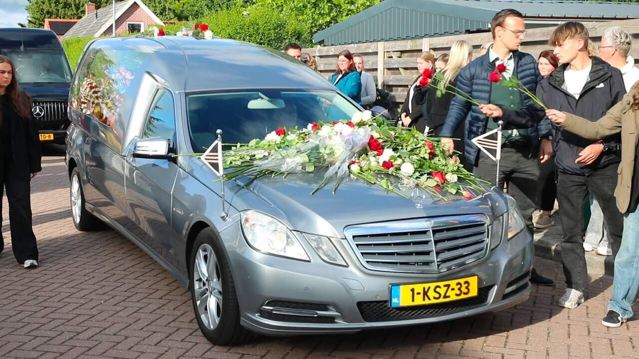 Image from Video: People Lay Flowers on Hearse Duration Memorial for Jeffrey and Emma