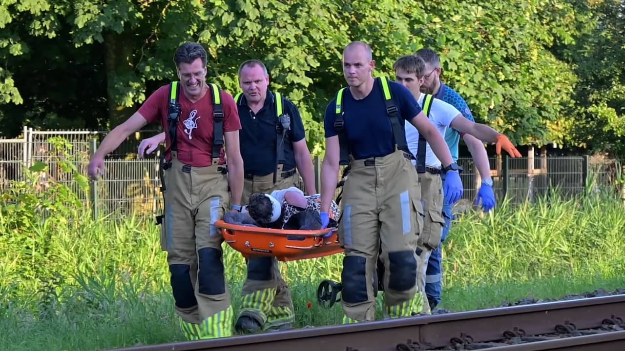 Image from Video: Emergency Services Carry Injured Person from NS Train After Explosion