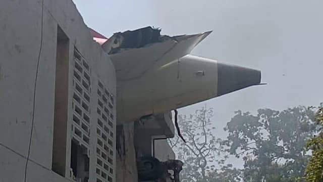Image from Video: Crashed Plane Lies on Top of Doctor's Residence in India