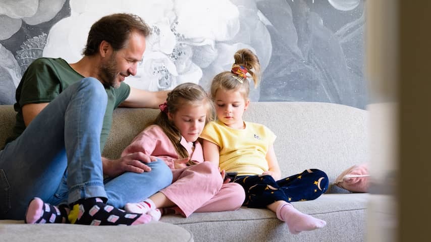 Father with children and a telephone