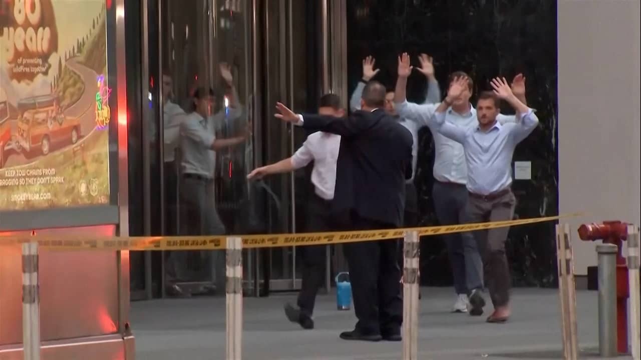Image from Video: Agents Run to Building in New York Where Shooting Tok Place