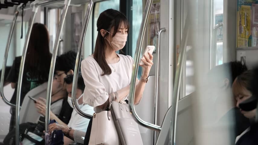 Woman with telephone in Tokyo