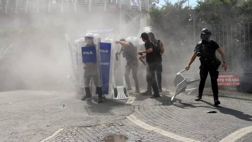 Turkish opposition members block headquarters with chairs and tables for police