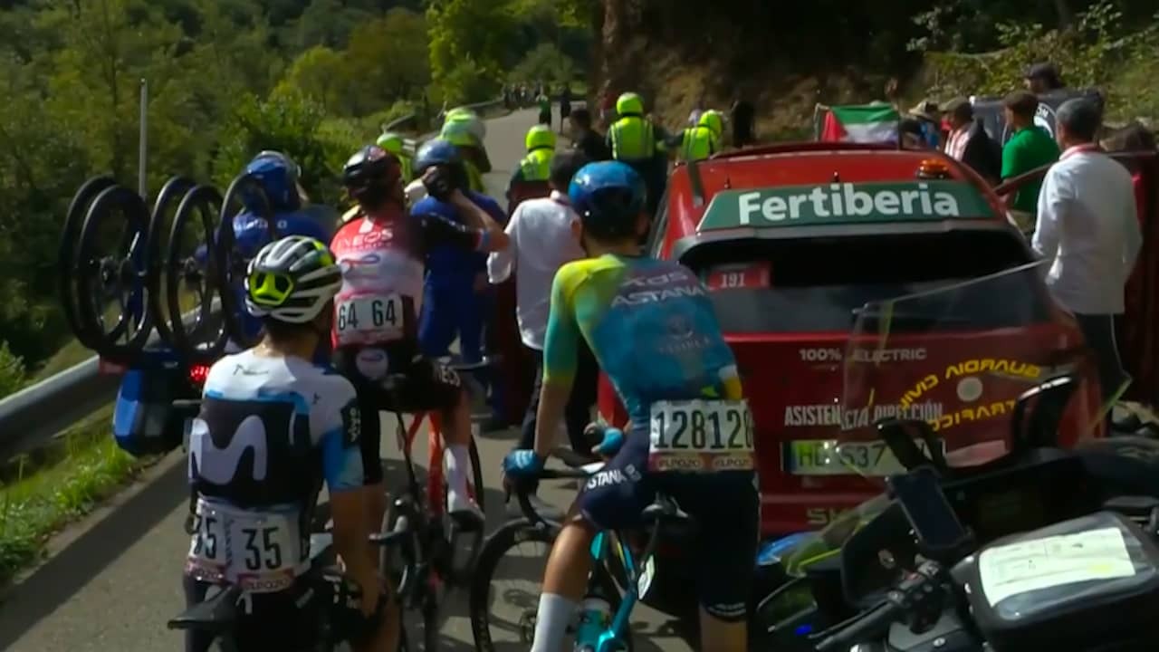 Image from video: demonstrators block leaders at the foot steep final climb of Vuelta