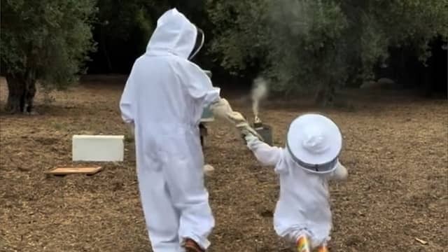 Meghan Markle and daughter Lilibet walk in beekeeper suit over estate