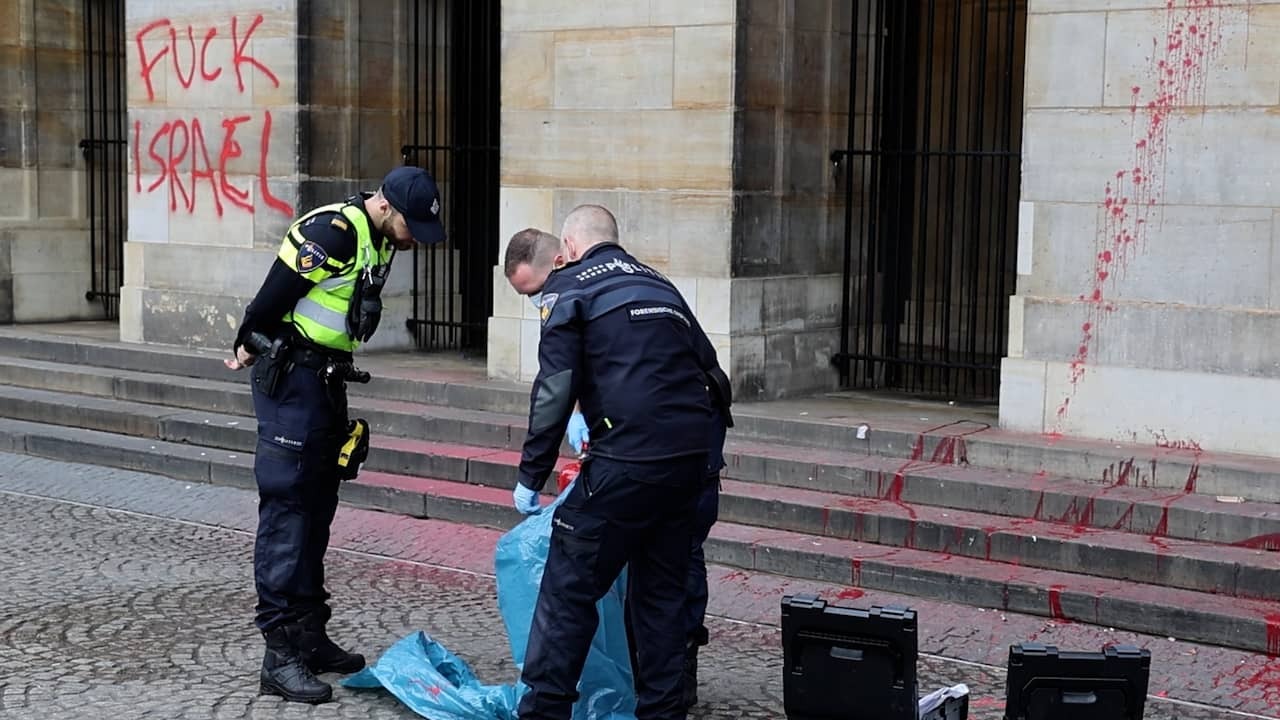 Cleaners Spray Red Paint From Palace on Dam Square After Daubing